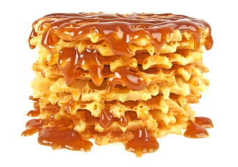 Waffles with caramel topping isolated on a white background