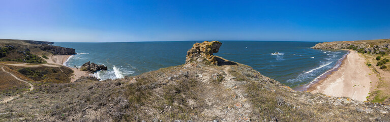 Fototapeta na wymiar panorama of the sea coast with rocks and sand beach