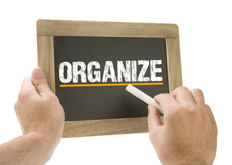Hand writing Organize on chalkboard