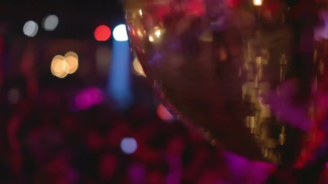 glitterball turning on the nightclub dancefloor