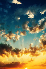 sunset with clouds, light rays and other atmospheric effect