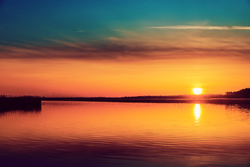Fototapeta na wymiar good orange sunset over river
