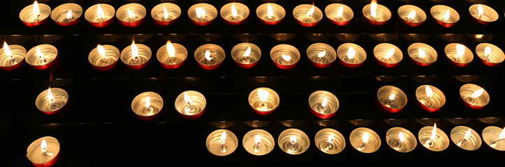 many candles inside the place of worship