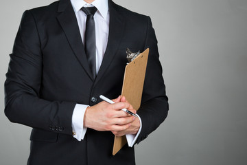 Businessman holding a clipboard
