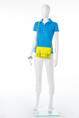 Female mannequin in polo t-shirt.