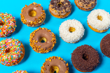 Assorted donuts on a blue background