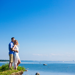 Fototapeta na wymiar portrait of happy couple over beautiful sea view
