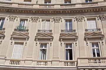 the old house with balconies and windows in Paris, France