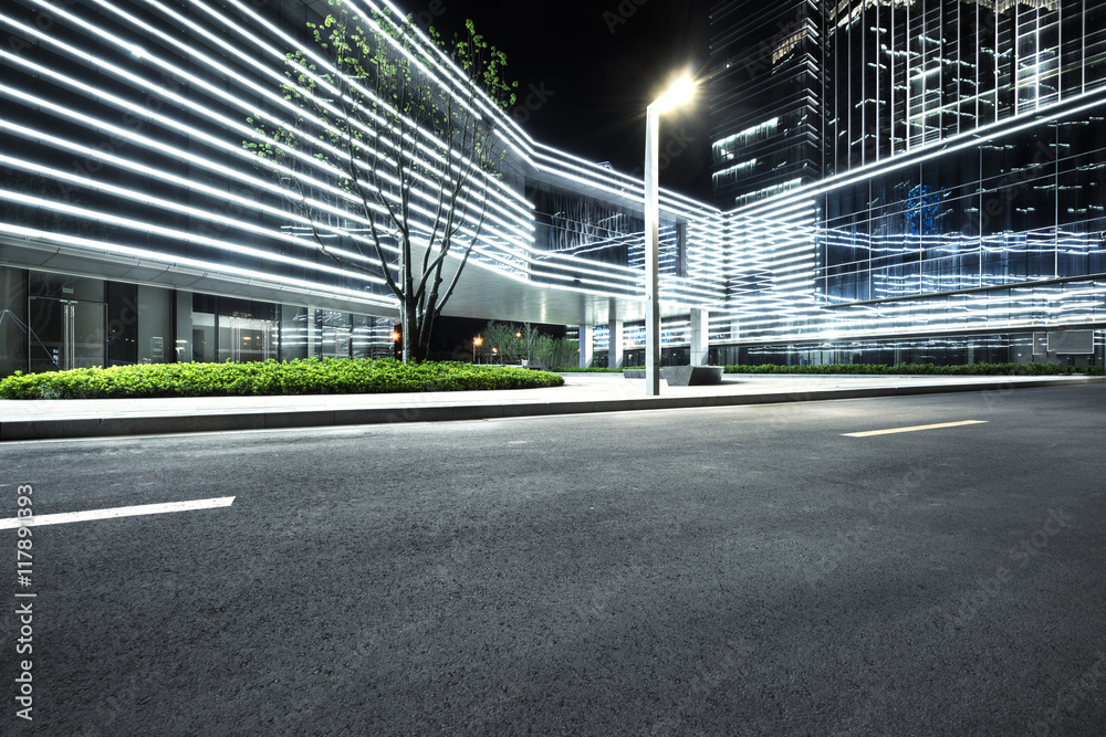 Wall mural city empty traffic road with cityscape in background