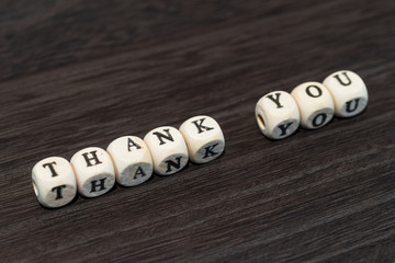 THANK YOU on wooden background