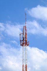 High telephone pole under the evening light and clear blue sky
