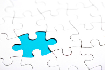 White puzzle with missing part