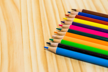 Obraz premium Colorful pencils on wooden background