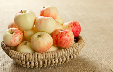 ripe apples in a beautiful wicker basket