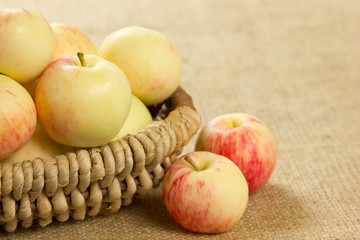 ripe apples in a beautiful wicker basket