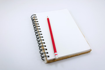 Notebook and red  Pencil  on white background