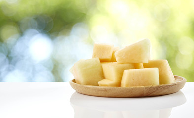 melon slice on wooden plate