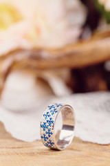 Romantic silver ring with blue gem