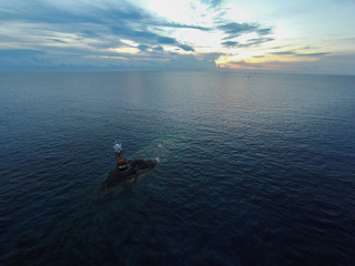 Ocean sea sunset view and lighthouse. Gulf of Thailand sea, Thailand, Wide angle view.