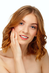 Fototapeta premium Beautiful young woman with blue eyes and red lips touching her c