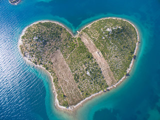 Aerial view of the heart shaped Galesnjak island on the adriatic coast.