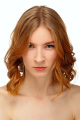 Naklejka premium Portrait of angry young woman with blue eyes and red lips. Beaut