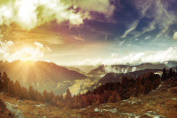 Outing trip in the mountains peak Austria Alps beautiful hills landscape with sky, clouds sunlight snow and forest