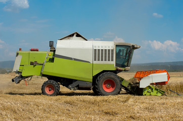 Combine harvesting wheat. Harvest.