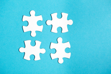 Four disconnected jigsaw puzzle pieces