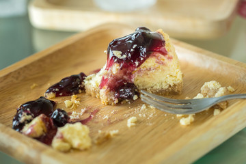 Cake crumbs leftovers on wooden plate