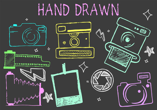 Vector hand drawn chalk illustration of cameras from different times. Photographic equipment set.
