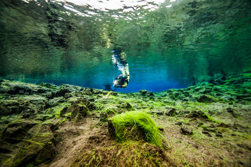 Scuba diving at the divespot Silfra in Iceland