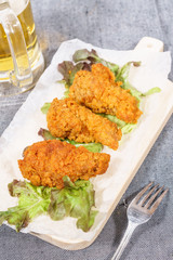 Fried chicken wing with beer
