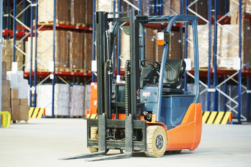 Pallet forklift truck at warehouse