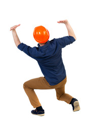 back view business man protective construction helmet protects hands from what is falling from above. Rear view people collection.  backside view of person.  Isolated over white background. The