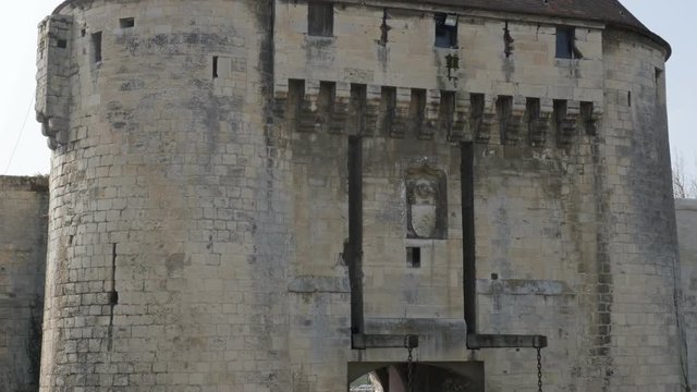 Old castle entrance and drawbridge system details tilting 4K 2160p 30fps UltraHD video - Draw-bridge tower and stone corridor entrance of the ancient fortification 4K 3840X2160 UHD slow tilt footage 