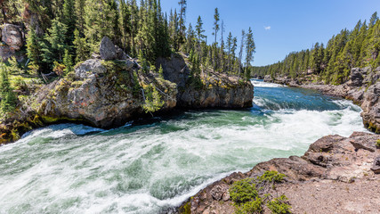 Fast flowing river on the background of the rocky coast. Brink of the upper falls, Grand Canyon of...