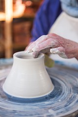 Close-up of potter making pot