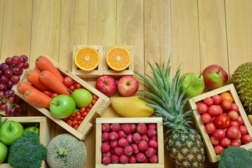 Top view various fruits and vegetables on the table with copy space