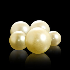 image of pearls on a black background closeup