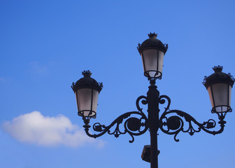 Fototapeta na wymiar Old lantern and blue sky