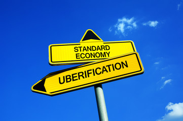 Standard economy vs Uberification - Traffic sign with two options - traditional business model vs...