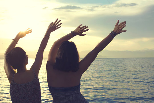 young women do the wave at a party at sea