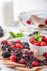 Cocoa pancakes with forest fruit