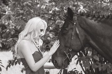 Portrait of a young woman and horse