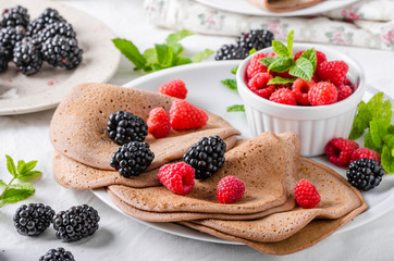 Cocoa pancakes with forest fruit