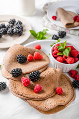 Cocoa pancakes with forest fruit