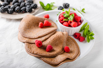 Cocoa pancakes with forest fruit