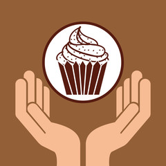 hand holding cupcake