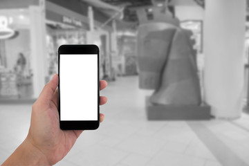 man hand holding the phone and white screen with blur black and